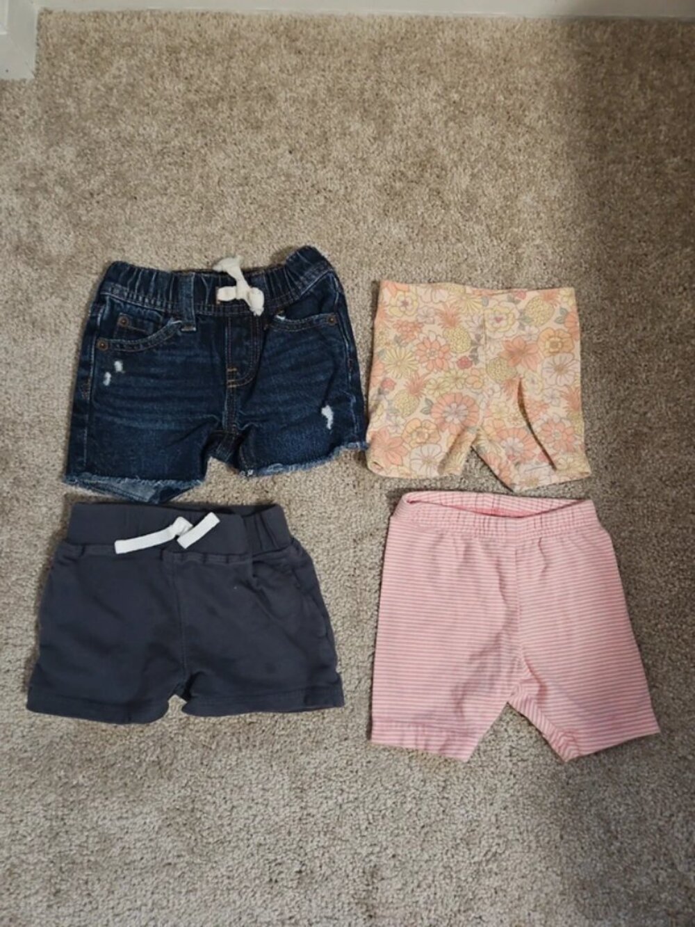 4 pairs of assorted shorts sizes 3-6 months and 6 months